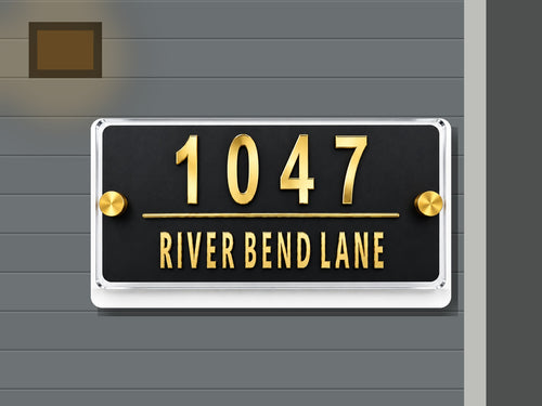 Modern black and gold mirror address sign 1047 shown installed on a contemporary home exterior