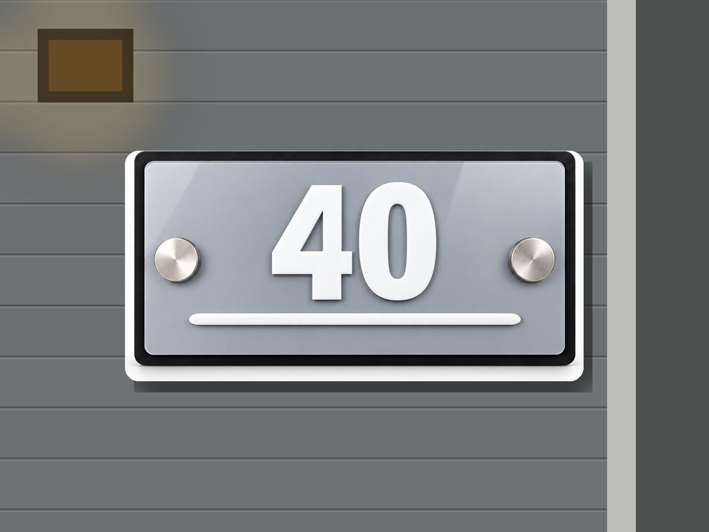 Modern gray and white address sign 40 shown installed on a contemporary home exterior