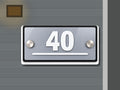 Modern gray and white address sign 40 shown installed on a contemporary home exterior
